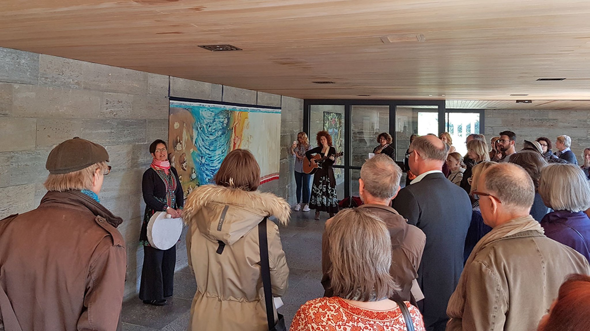 Fearless vernissage visitors inside the exhibition space