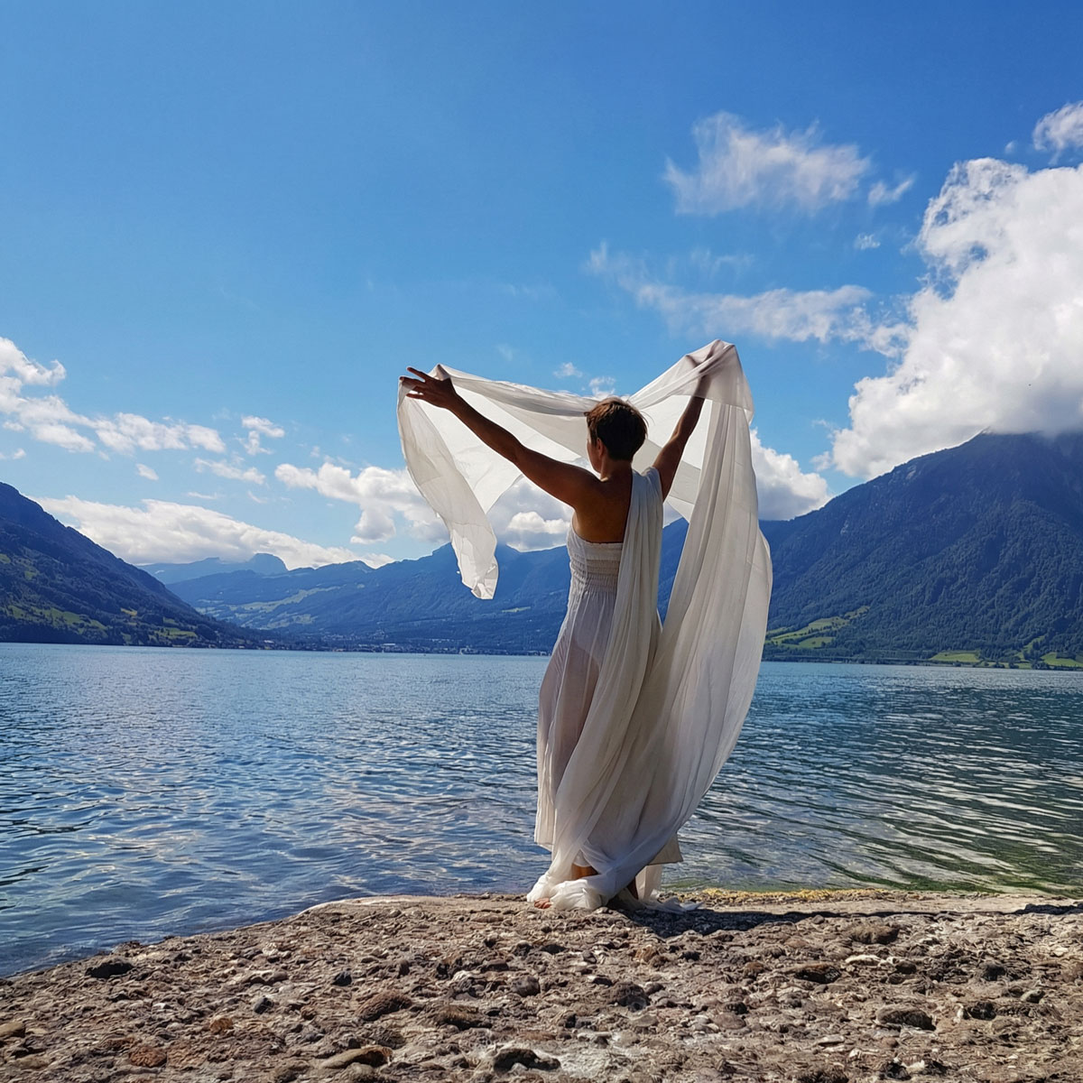 Painted silk unfolding through collaborative movement